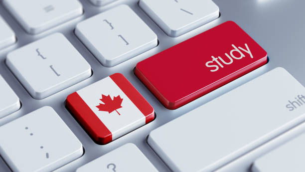 A computer keyboard with mostly white keys, featuring two prominent red keys—one with the Canadian flag and another labeled "study"—symbolizing education or studying in Canada.